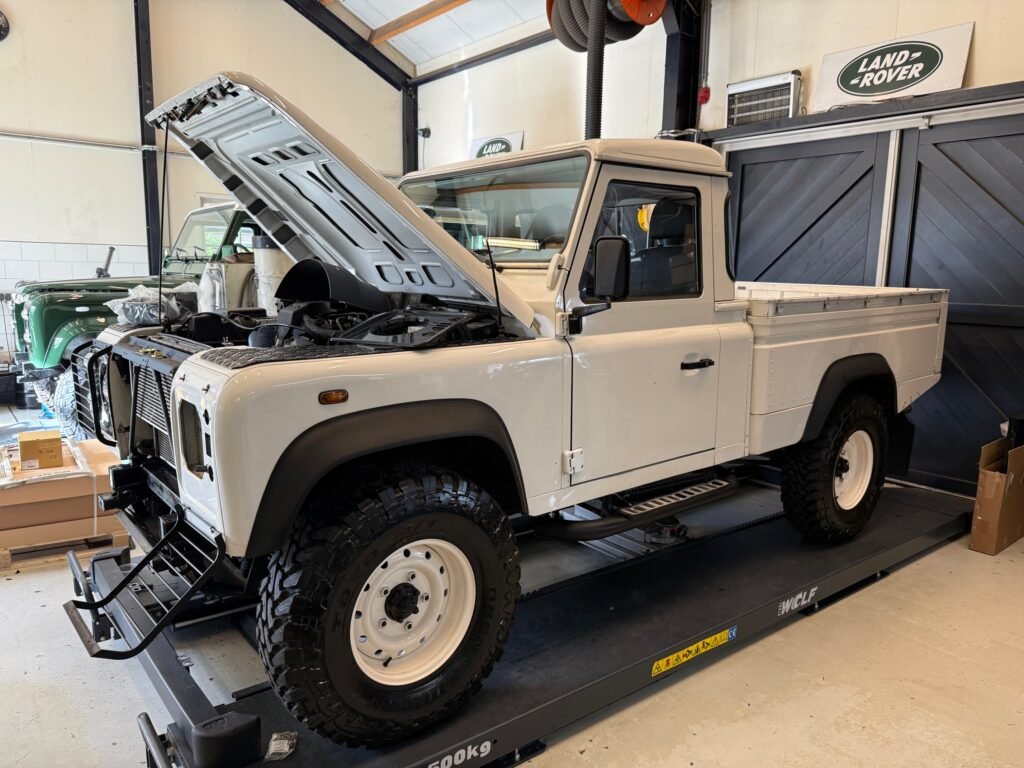 2009 Defender 110 HCPU White left front in shop